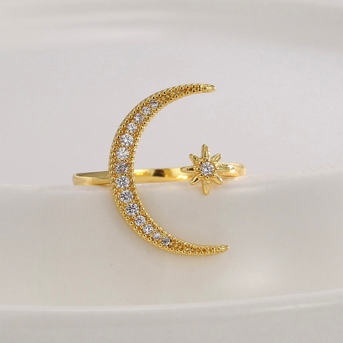 Crescent diamond-encrusted open tail ring